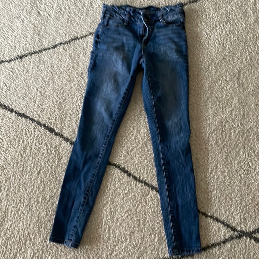 These jeans are the brand named blue spice with ruffles around the waist